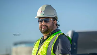 Professional portrait of a construction engineer wearing safety gear in Qatar