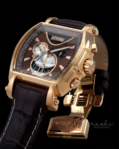 Luxury watch product photography on a black background.